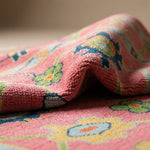 Close-up of the Pink Hand Knotted Rug Oushak highlighting intricate textures and micro-details with soft natural lighting.