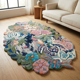 Close-up of a hand tufted floral wool area rug highlighting intricate floral patterns and plush texture in a modern living room.