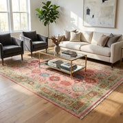 Elegant pink Turkish Oushak hand-knotted rug displayed in a modern living room with minimalist neutral furniture, emphasizing intricate patterns and plush texture.